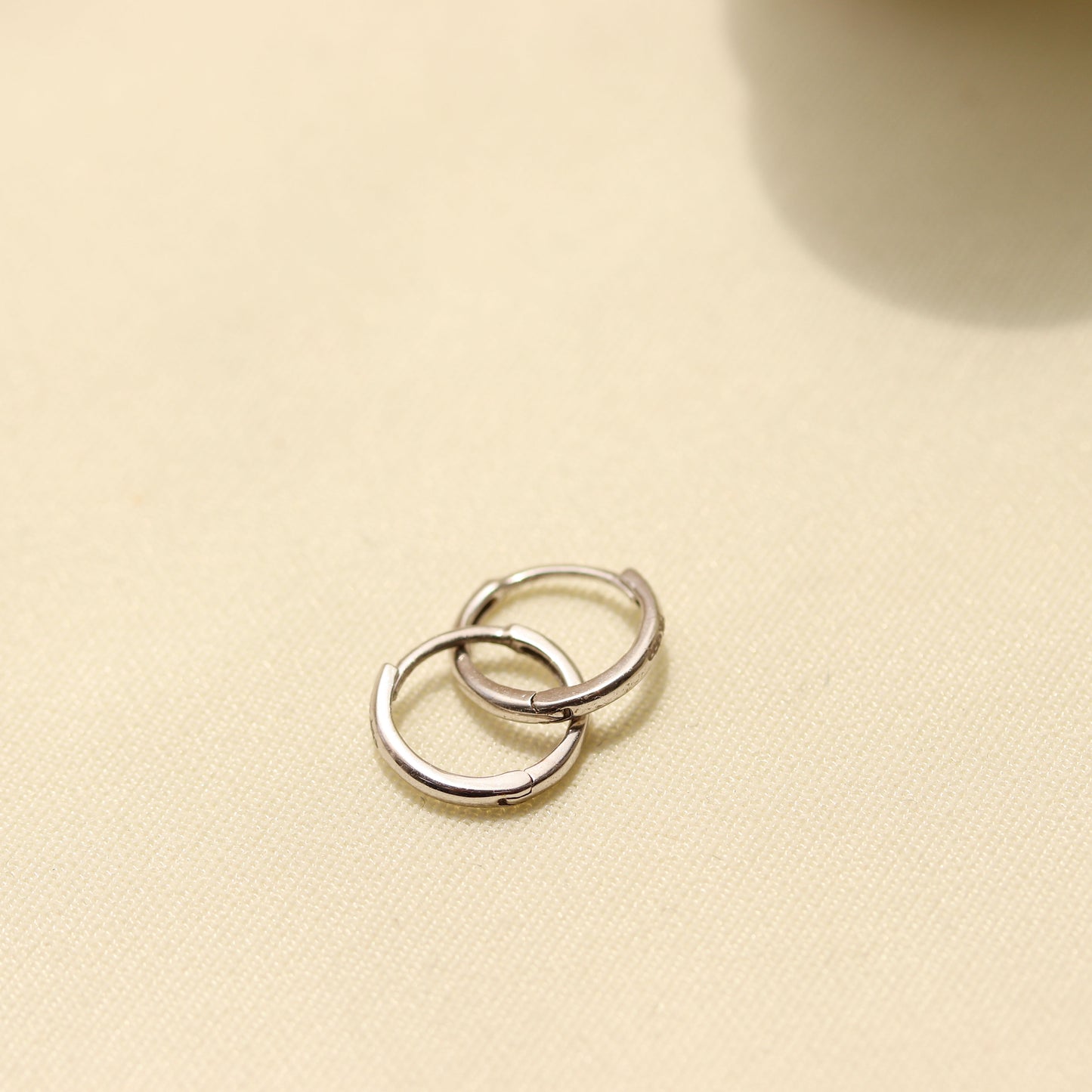 White Gold Tiny Huggie Hoop Earrings