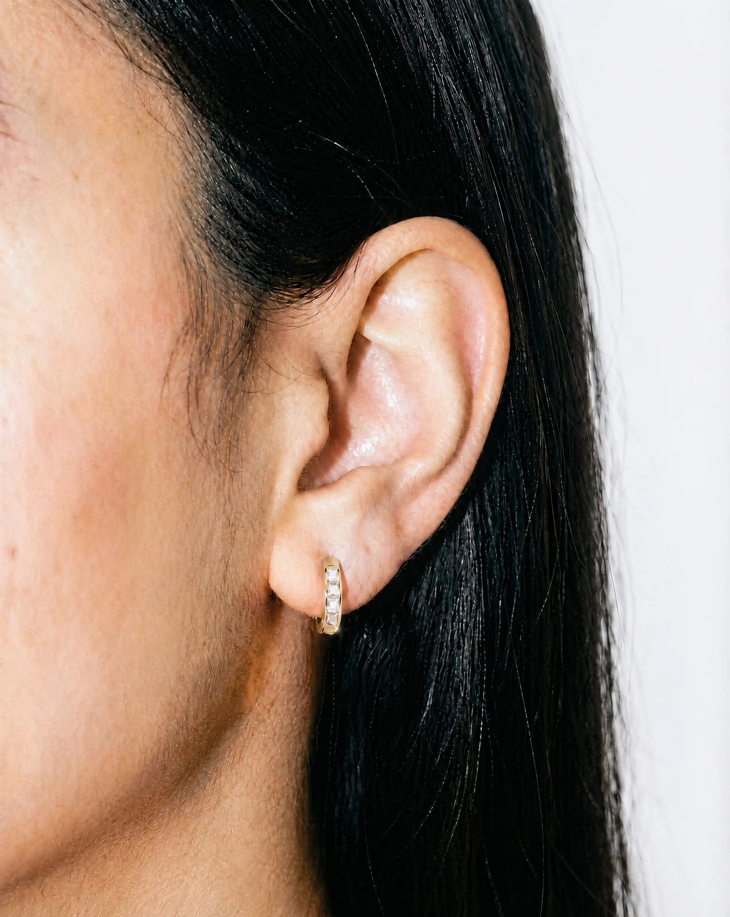 White and Gold Huggie Earrings